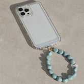 Telefoonsieraad bowtie pearl blue